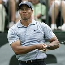 Tiger Woods is sitting on back after Geoff Ogilvy's 5-under-par 67 Friday gave him the lead over Woods in Miami.