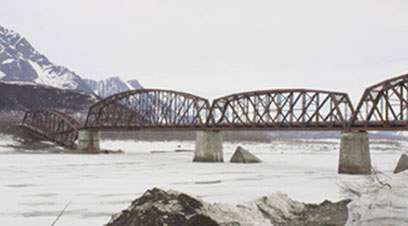 Home of the trans-Alaska oil pipeline, Alaska has been the setting for a few epic engineering battles rendered against nature. The Million Dollar Bridge, standing almost intact on the lower Copper River, is a reminder of another improbable Alaska construction project.