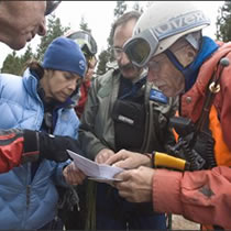 A plane loaded with skydivers has been located in the rugged terrain of Washington state, but no signs of life were found.