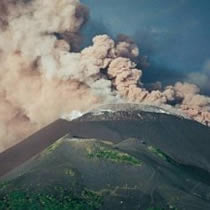Mount Soputan erupted in central Indonesia and a powerful earthquake hit western Indonesia Thursday.