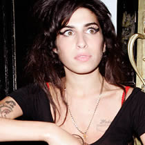 Singer/druggie Amy Winehouse and her enabler husband were arrested for marijuana possession in Norway.