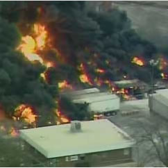Huge explosions engulfed the Chemcentral Corp. chemical plant in flames Wednesday, forcing evacuations as the fire spread to nearby houses and delivered a toxic cloud over the city.